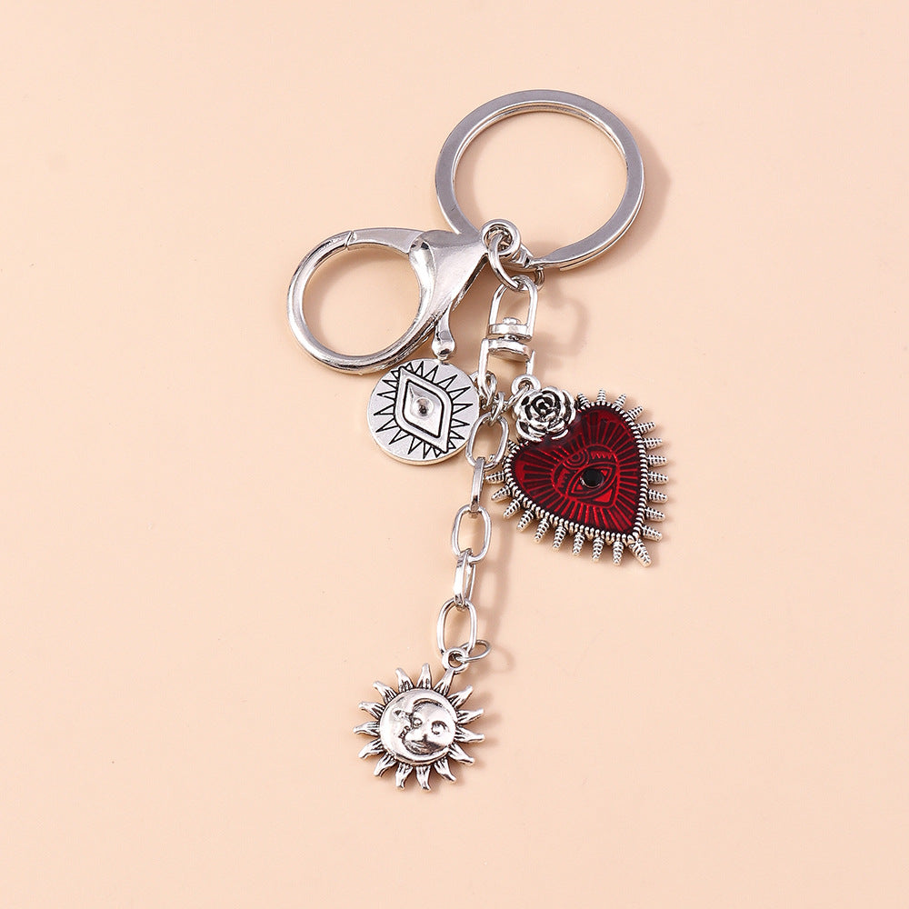 Wholesale Butterfly Cross Hollow Lace Love Devil Eyes Keychain