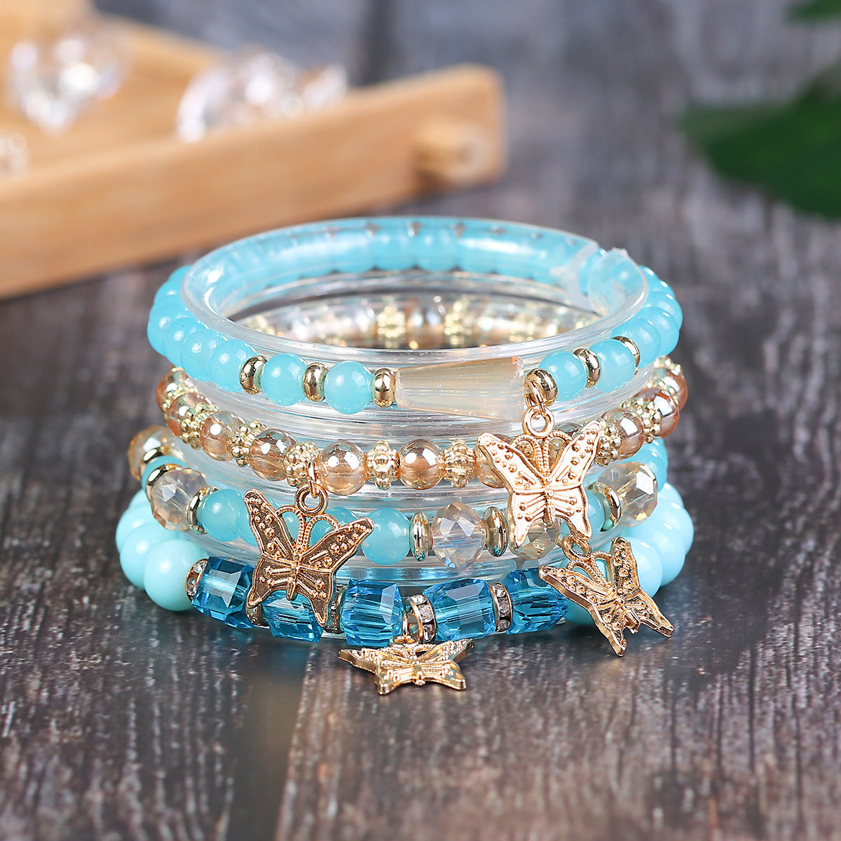 Wholesale Four Layer Butterfly Pendant Glass Elastic Bracelet