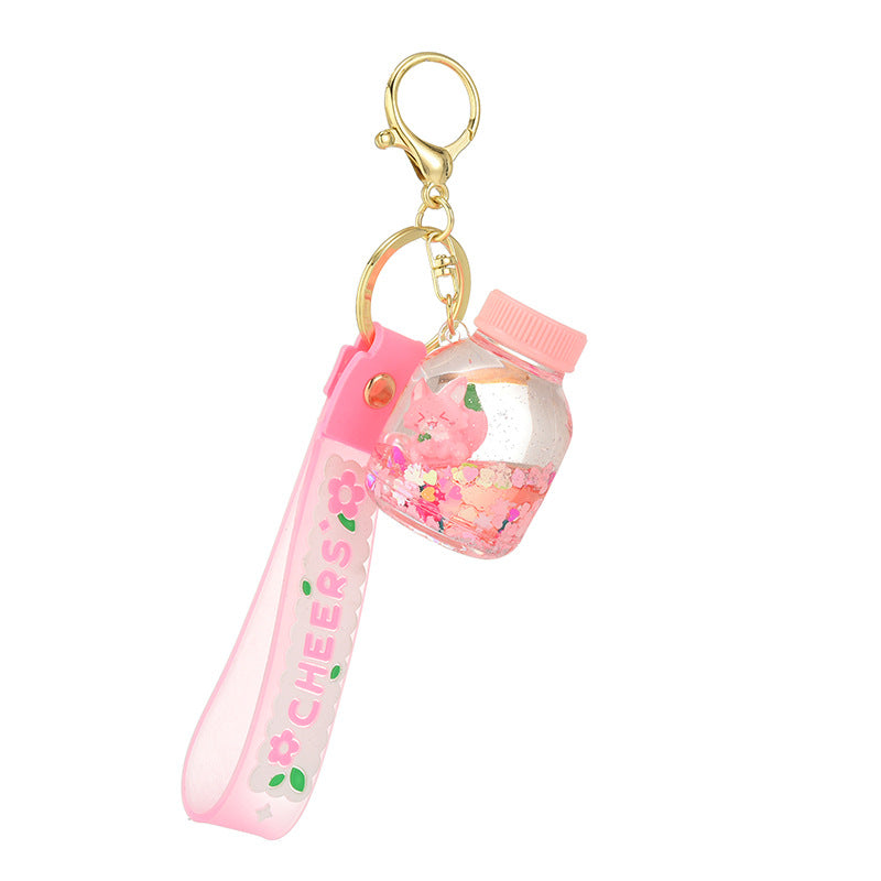 Acrílico al por mayor en la cadena de llave de botella de arena de la logística del flotador de aceite