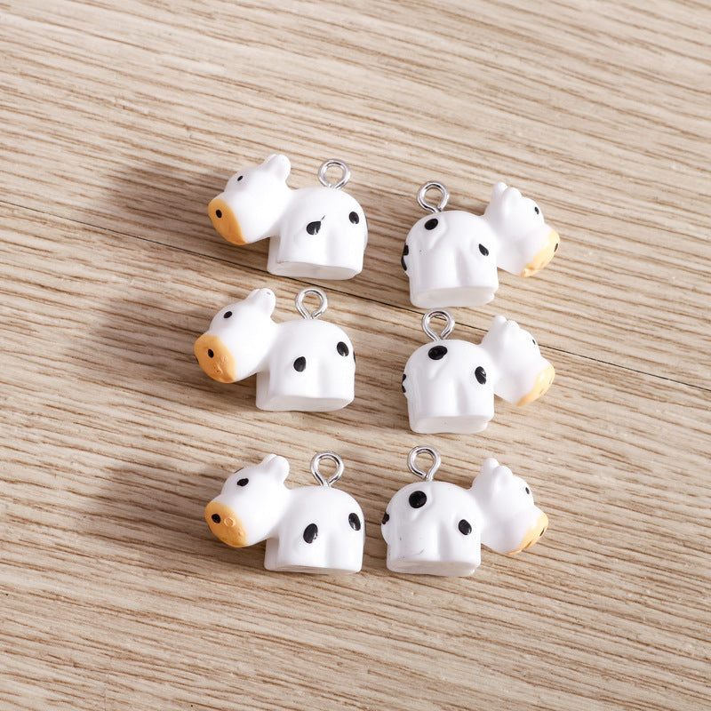 Wholesale 10 PCS/PACK of Cartoon Cow Resin Accessories DIY Keychain Jewelry Pendant
