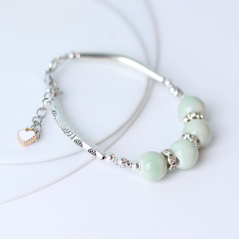 Tubo de curvatura al por mayor cuentas de cerámica pulsera de cuerda hecha a mano