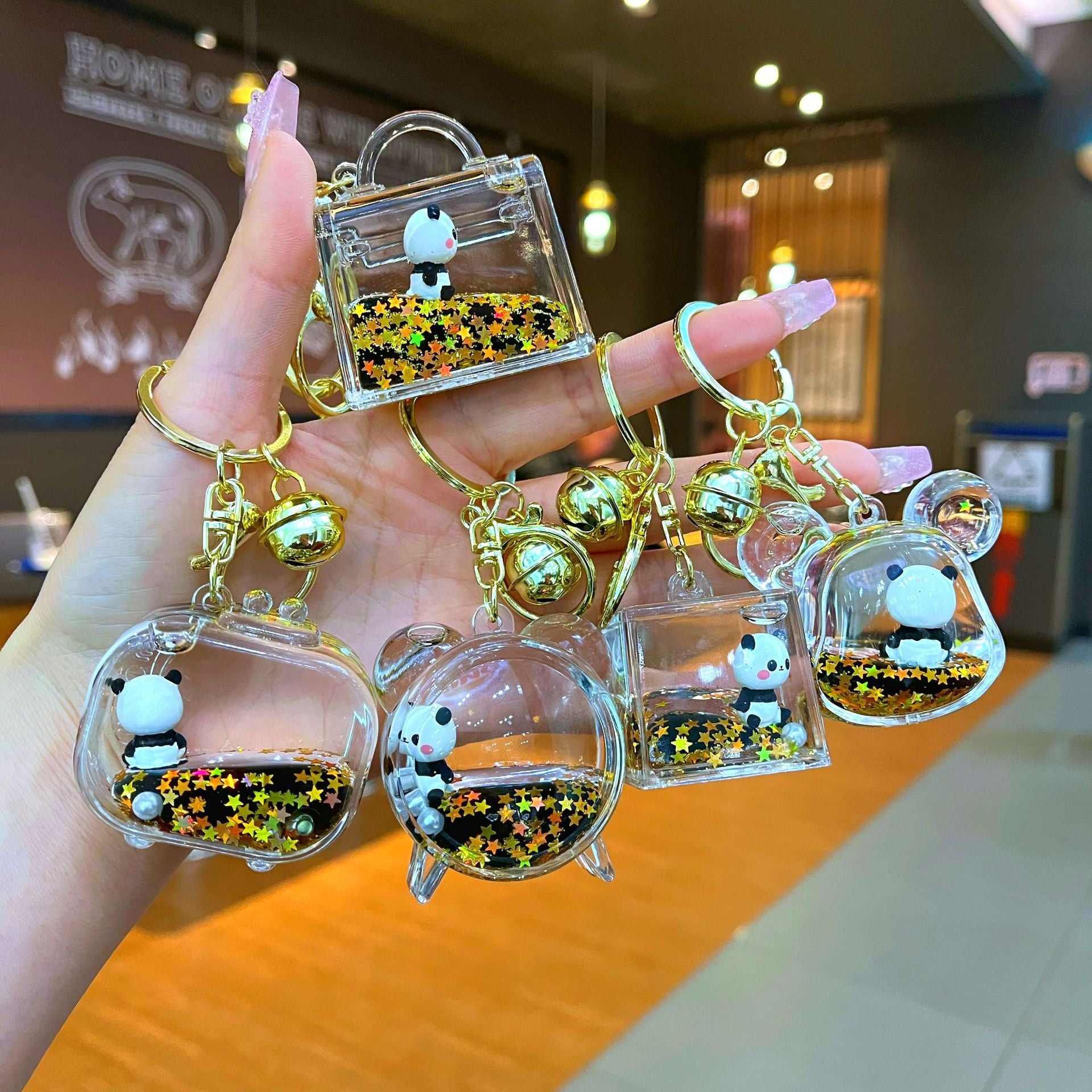 Wholesale Black gold floating cartoon cute panda Liquid Keychains