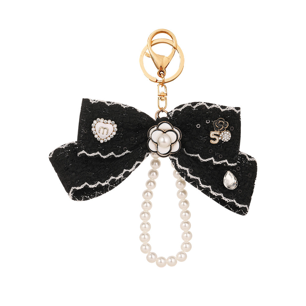 Wholesale Black and white color  style camellia pearl chain bow keychain
