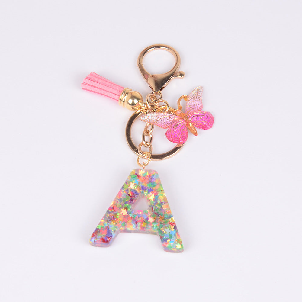 卸売スパンコール英語蝶タッセル文字樹脂キーホルダー