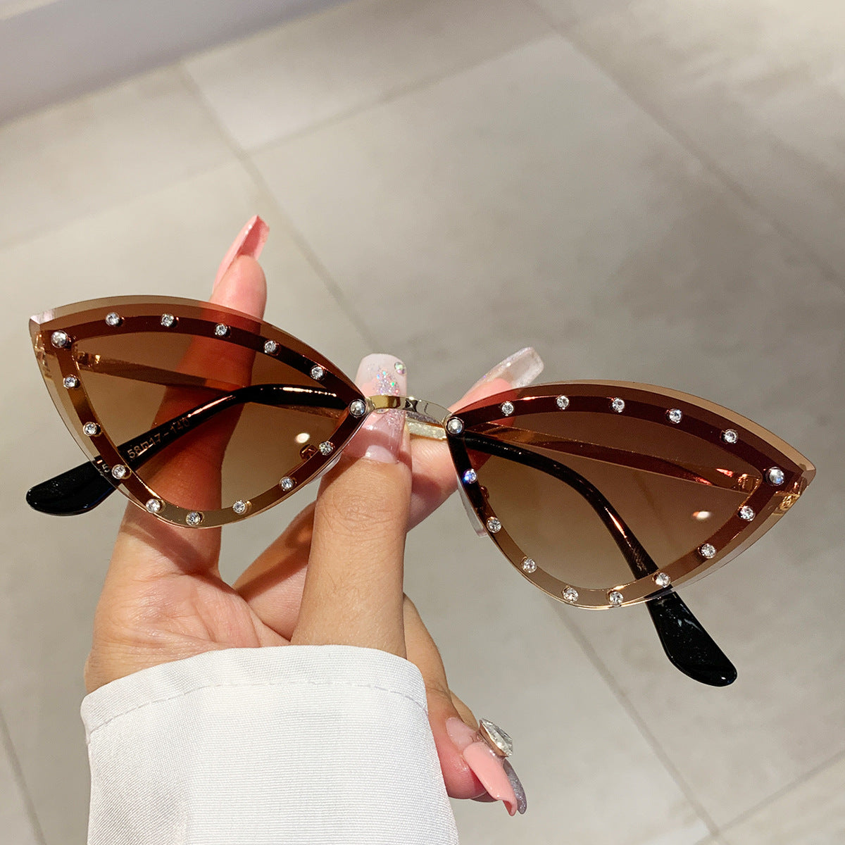 Wholesale Colorful rimless diamond cat-eye sunglasses