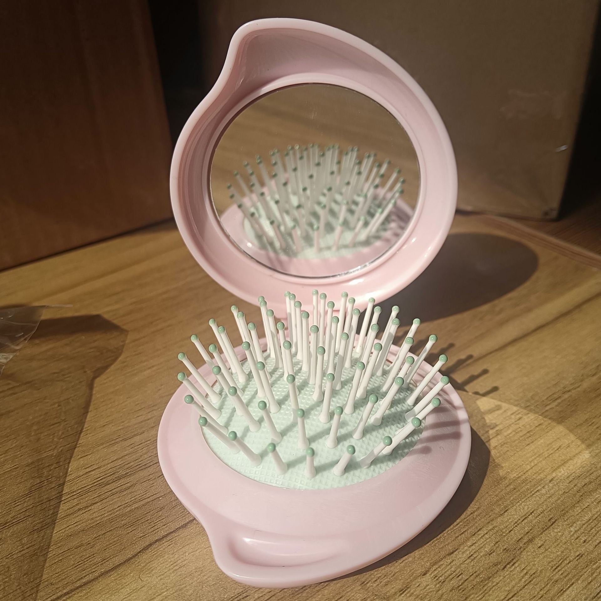 Wholesale ABS Droplet Shaped Cream Gel Folding Mirror Airbag Comb