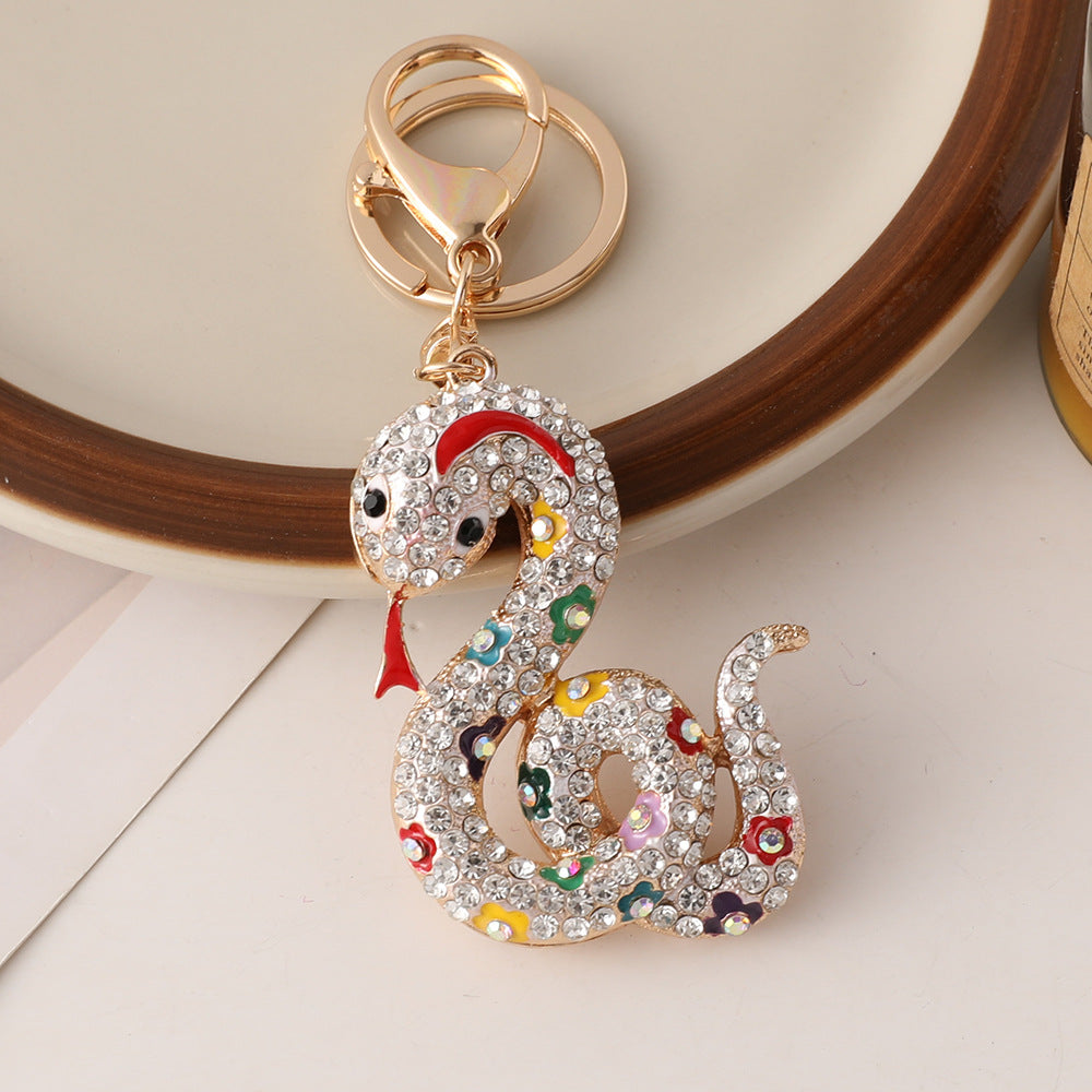 Wholesale Creative cartoon diamond twelve zodiac snake metal car keychain national tide this year pendant small gifts