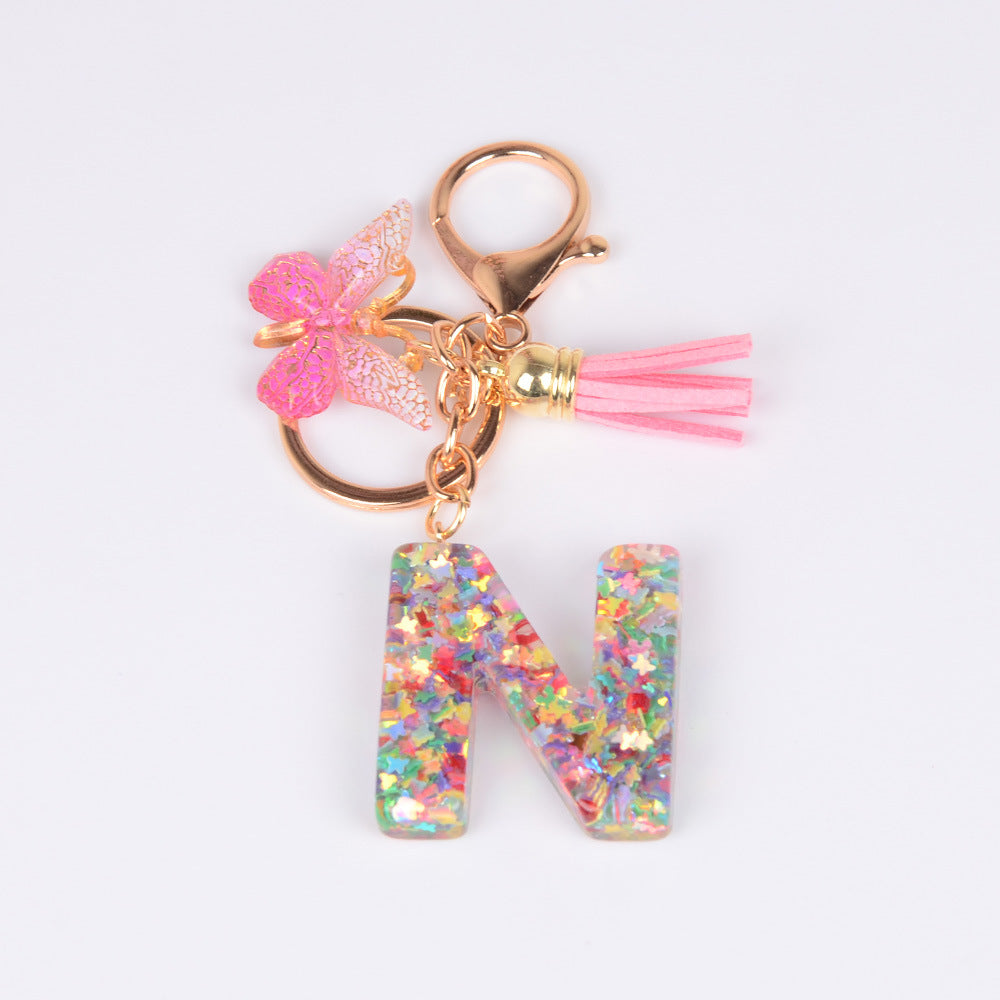 卸売スパンコール英語蝶タッセル文字樹脂キーホルダー
