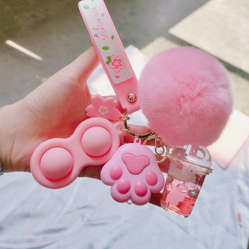 Silicona de silicona al por mayor Liquid Glow Cat Claw Fur Ball Keychain