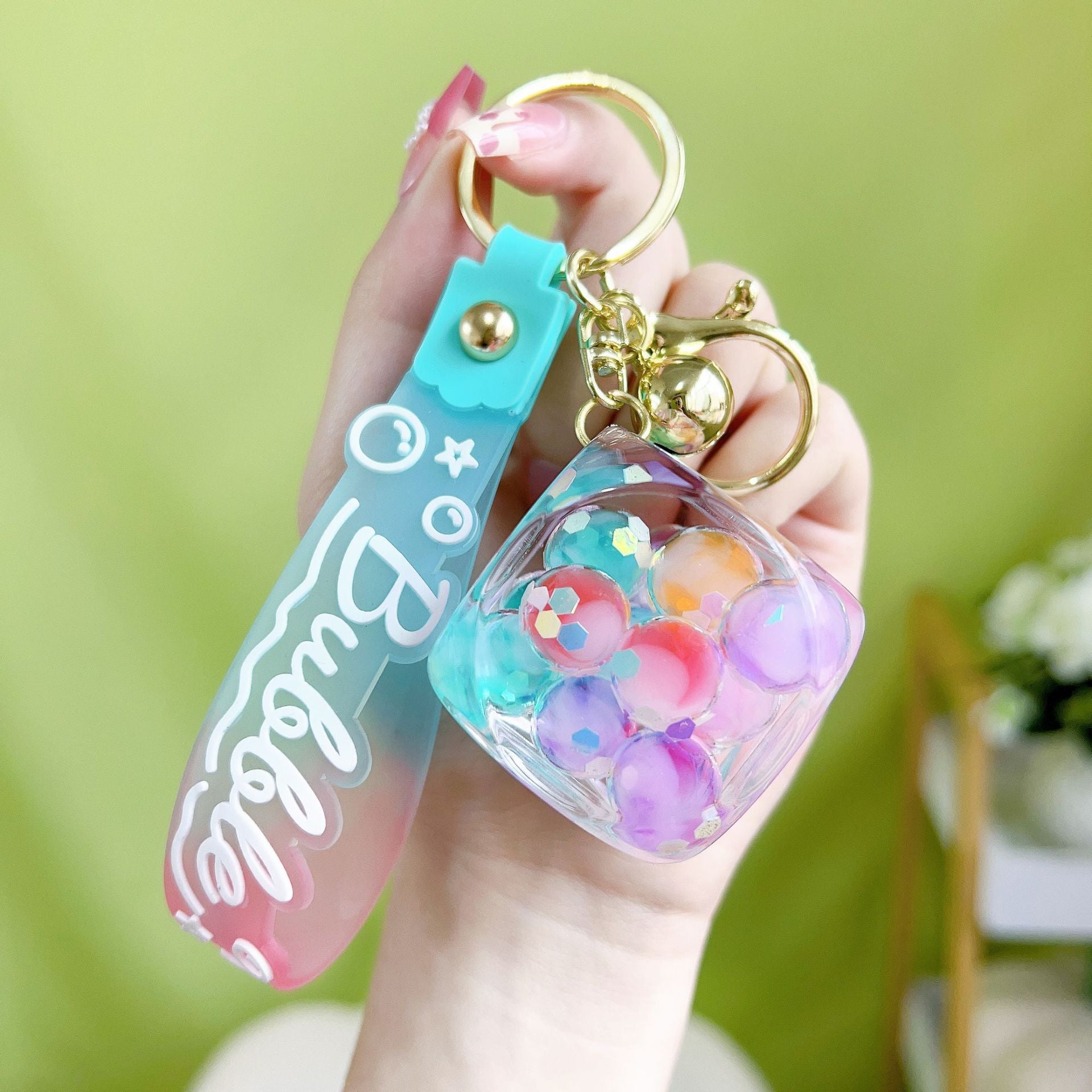 Botellas de burbujas de burbujas de luz nocturna al por mayor llavero acrílico