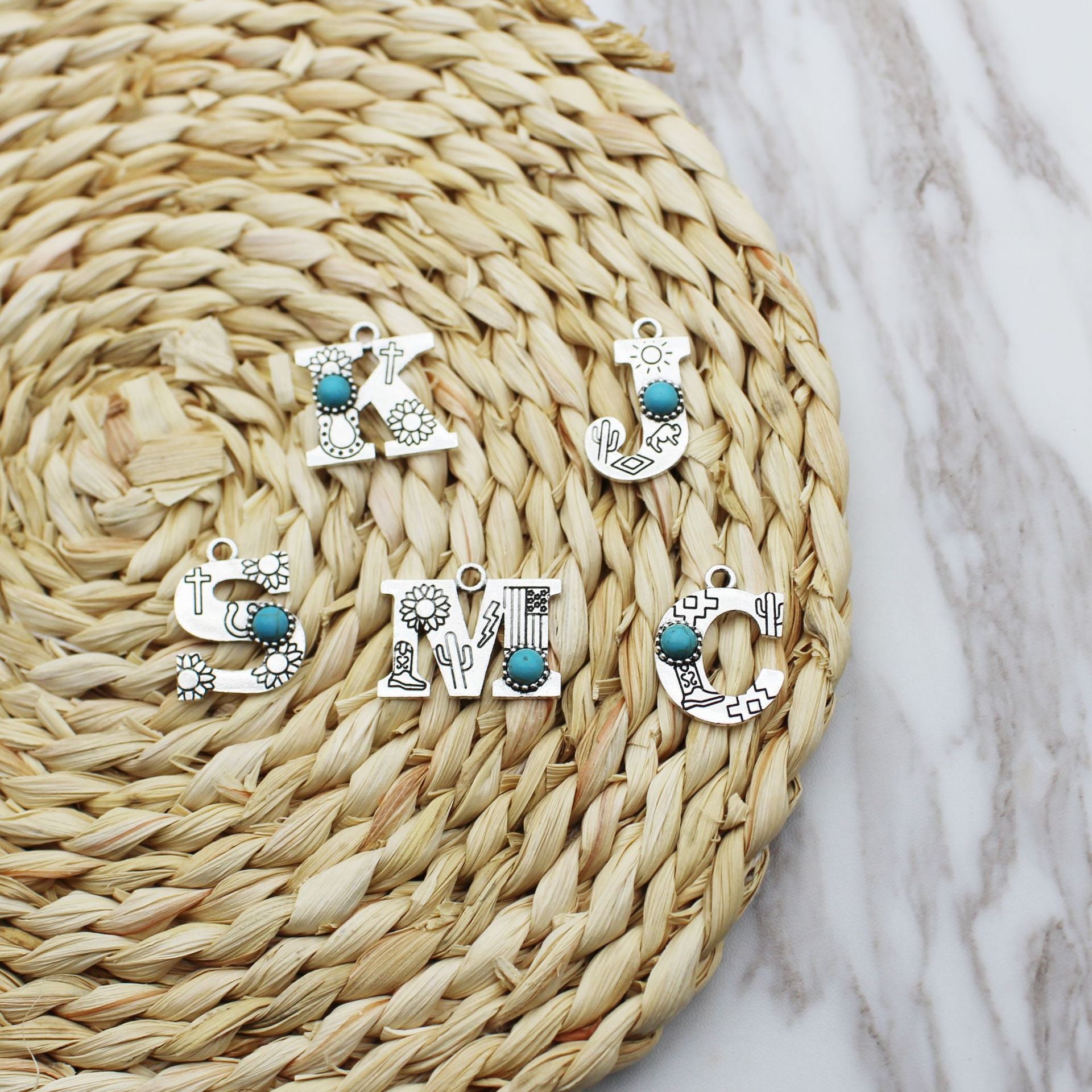 Wholesale of Western Wind Letter Natural Turquoise Alloy Letter Keychain Accessories