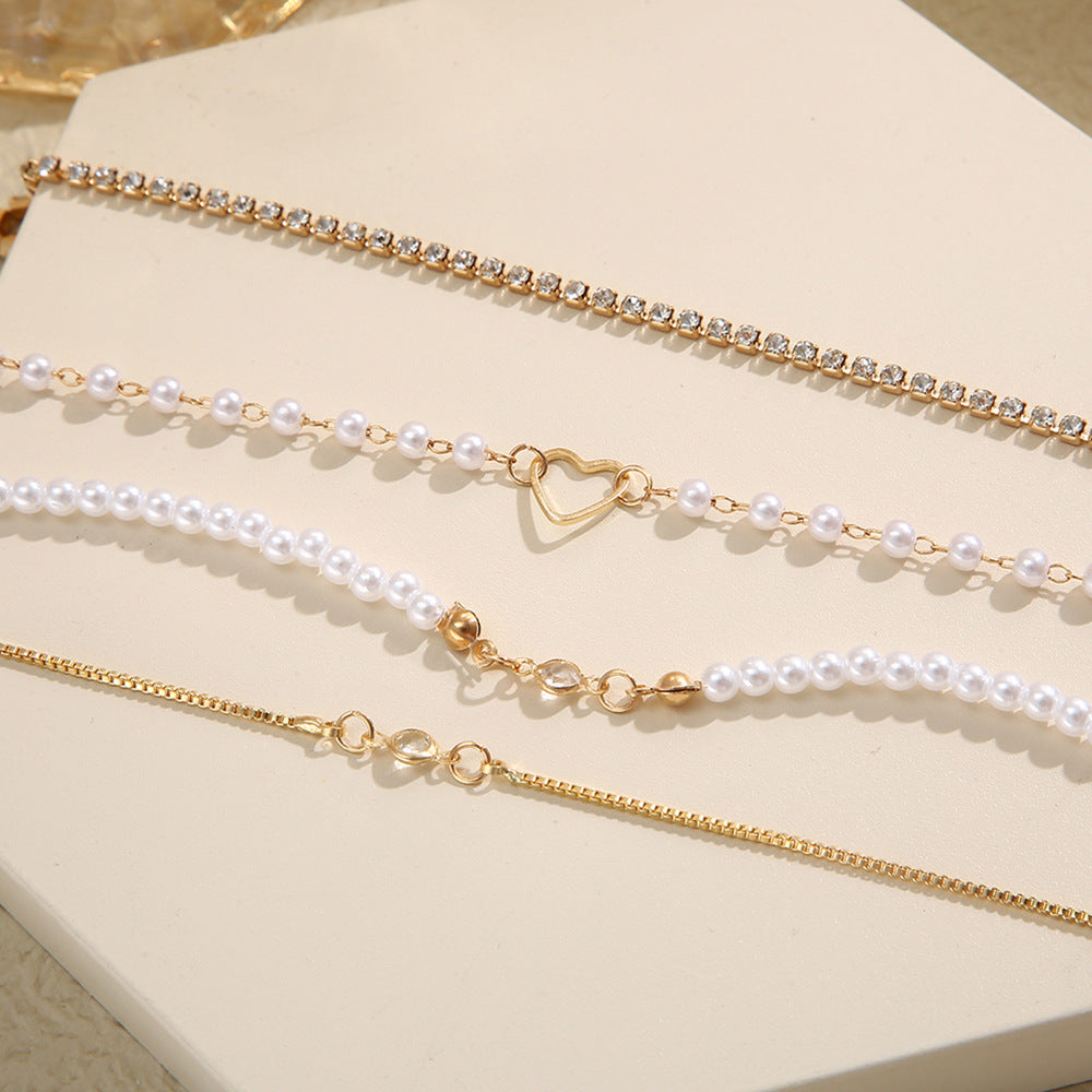 Wholesale Inlaid Diamond Hollow Peach Heart Pearl Alloy Bracelet Set