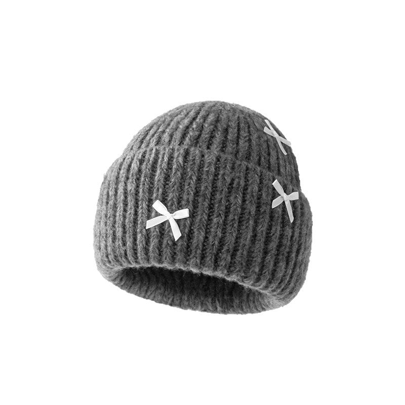 Wholesale Sweet woolen hat with bow for autumn and winter