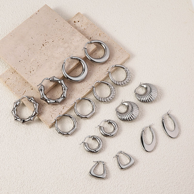 Wholesale High-end Oval Smooth Hollow Non Fading Irregular Decorated Titanium Steel Earrings