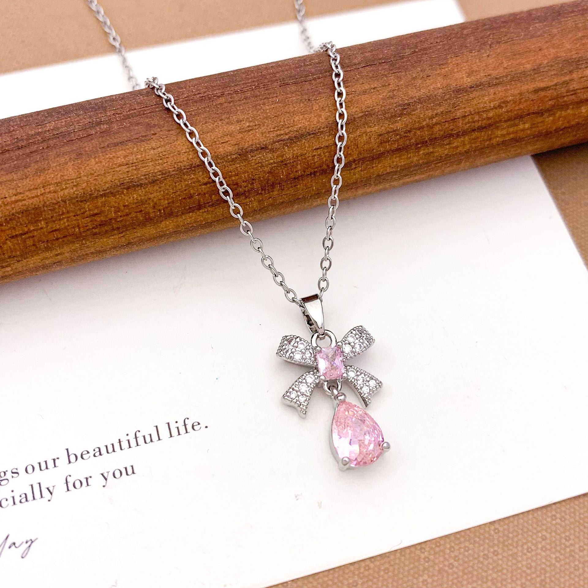 Wholesale Pink heart-shaped bow with diamond studded titanium steel necklace