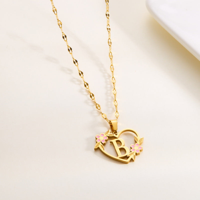 Wholesale 26 letter heart-shaped flower hollow Titanium Steel Necklace