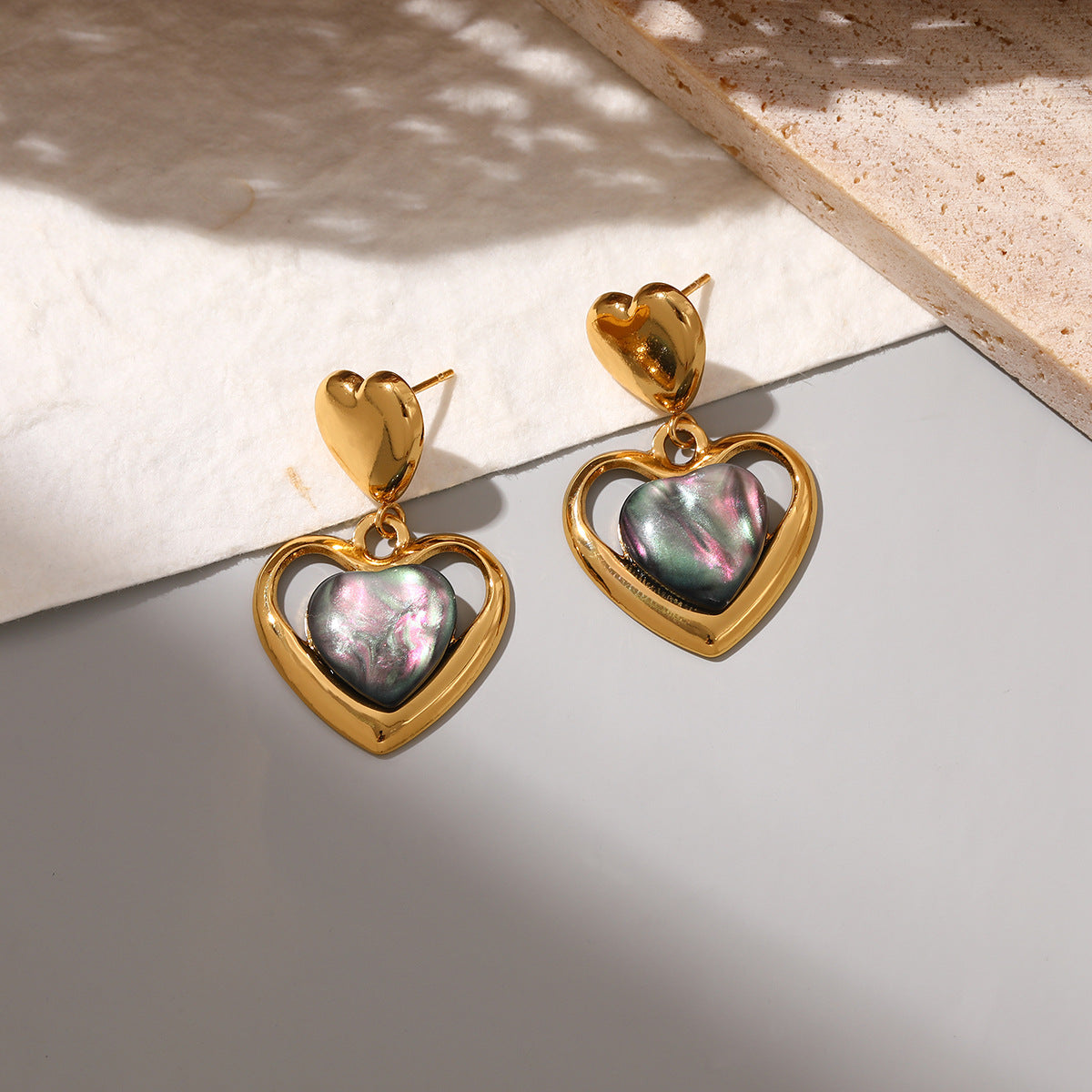 Wholesale Stainless steel heart earrings for women inlaid with cat' s eye stone