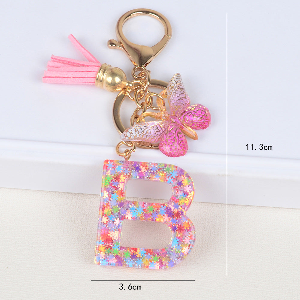 卸売スパンコールスノーフレークレター樹脂キーホルダー