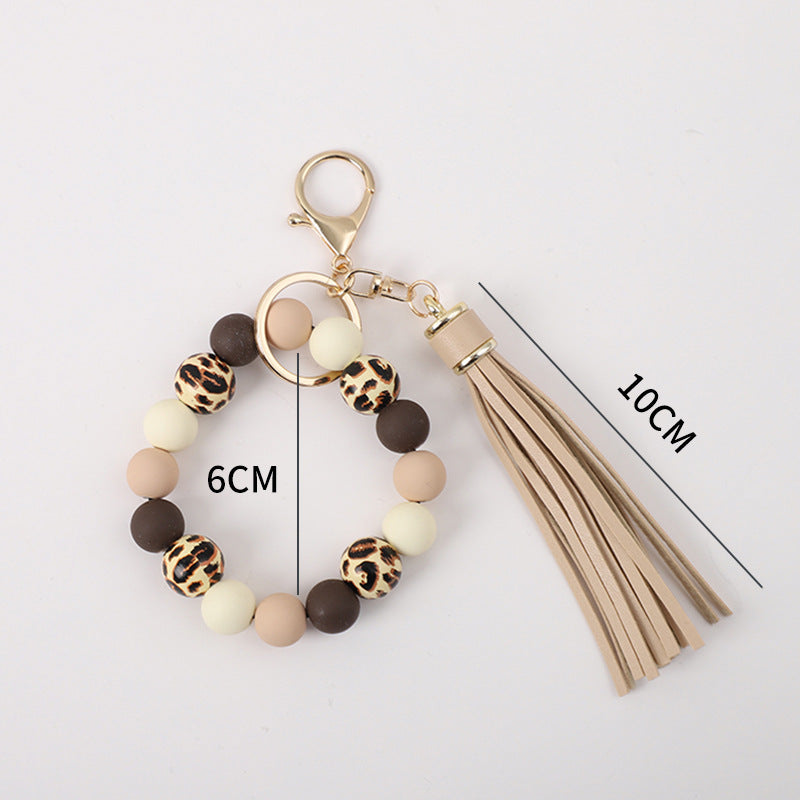 Llavero de muñeca de silicona de borla al por mayor