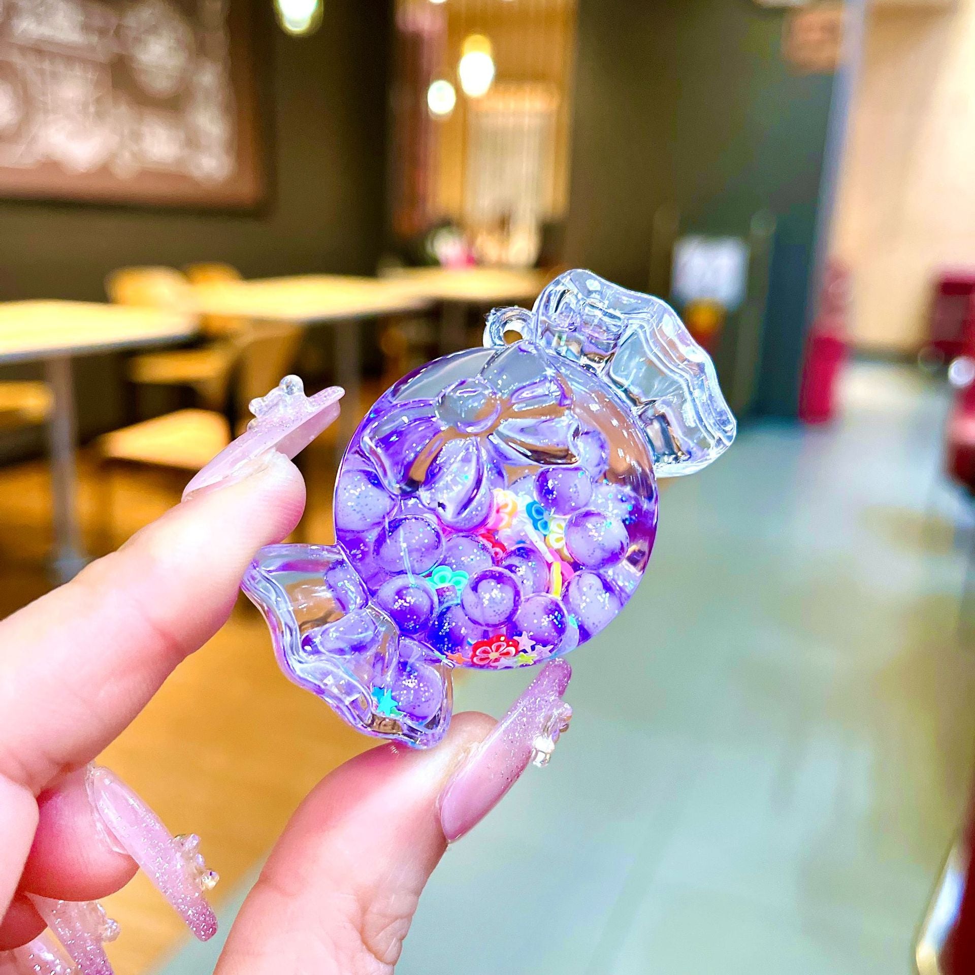 Wholesale Oil filled luminous colorful candy quicksand bottle keychain