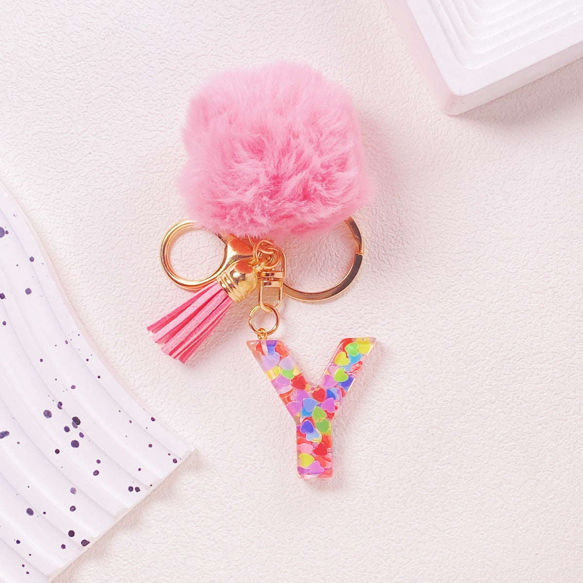 Wholesale Hairball English 26 letter pink Pom Pom keychain