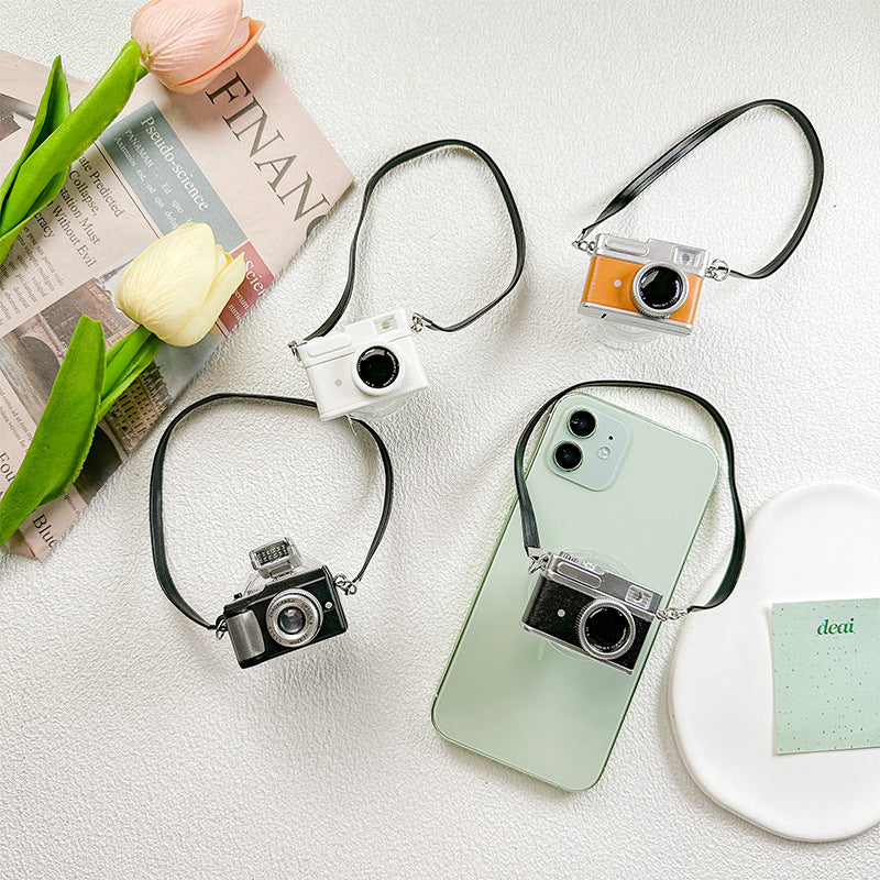 Simulación de cámaras al por mayor Soporte de airbag de teléfono móvil de plástico