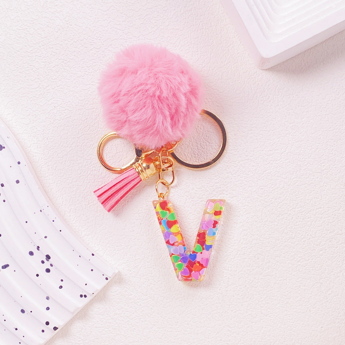 Wholesale Hairball English 26 letter pink Pom Pom keychain