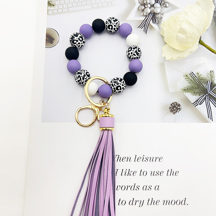 Wholesale Leopard Print White Bottom Wooden Beads Rubber Paint Round Beads PU Tassel Bracelet Keychain