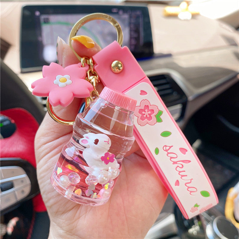 Wholesale Cherry Blossom Bunny Into Oil Milk Tea Cup Floating Bottle Acrylic Keychain