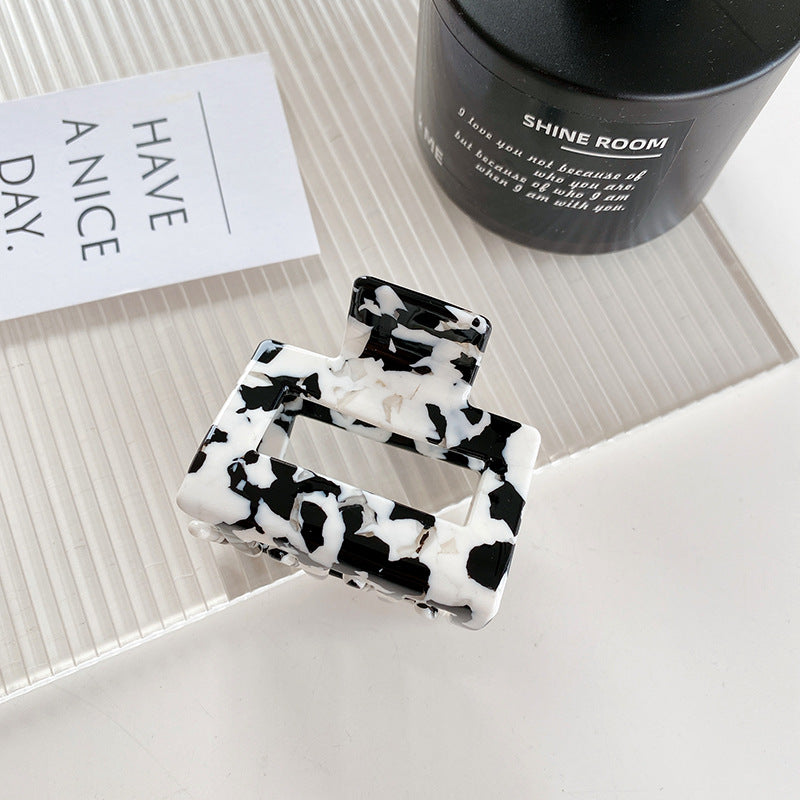Wholesale Cow Black and White Medium Hollow Acetate Plate Hair Clips