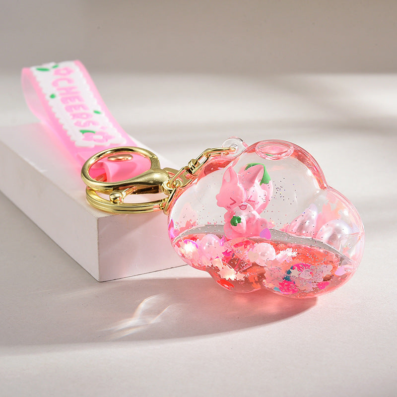 Acrílico al por mayor en la cadena de llave de botella de arena de la logística del flotador de aceite