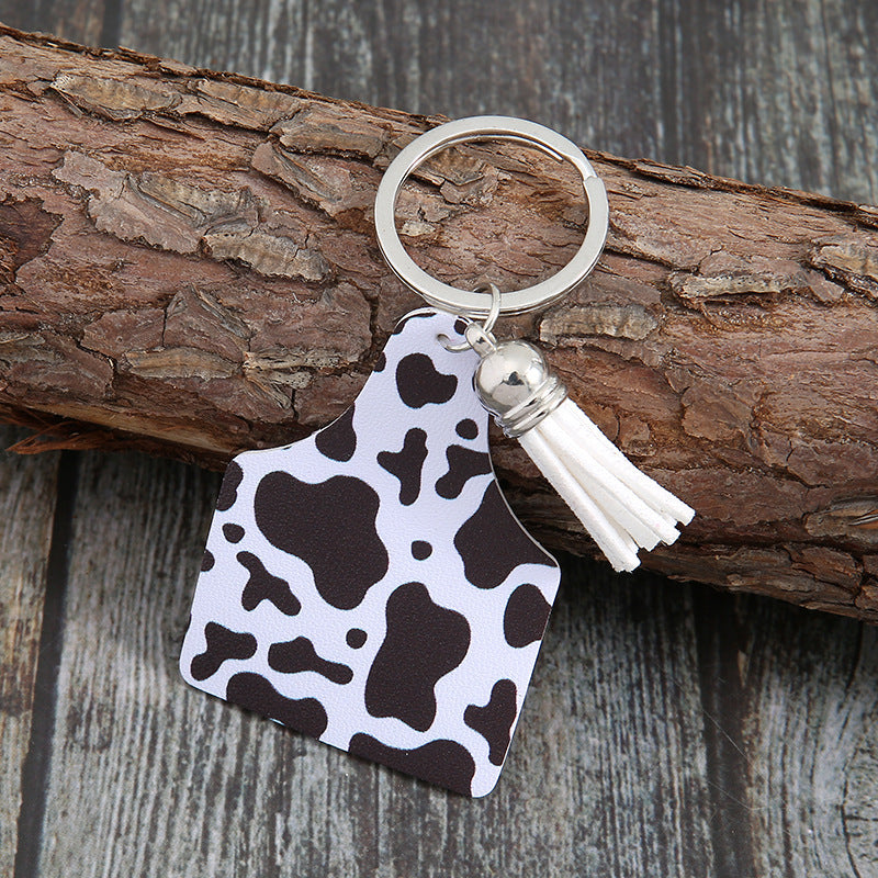 Patrón de vaca de estilo occidental al por mayor Cactus Animal Pattern Tassel Keychain