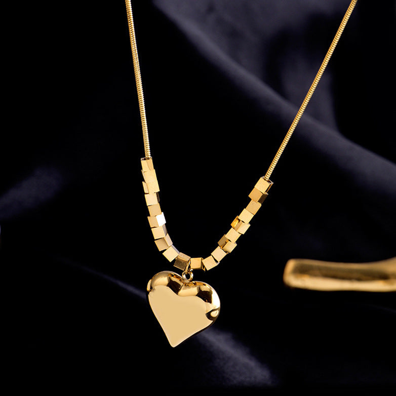 Collares de acero de titanio colgante colgante de corazón al por mayor