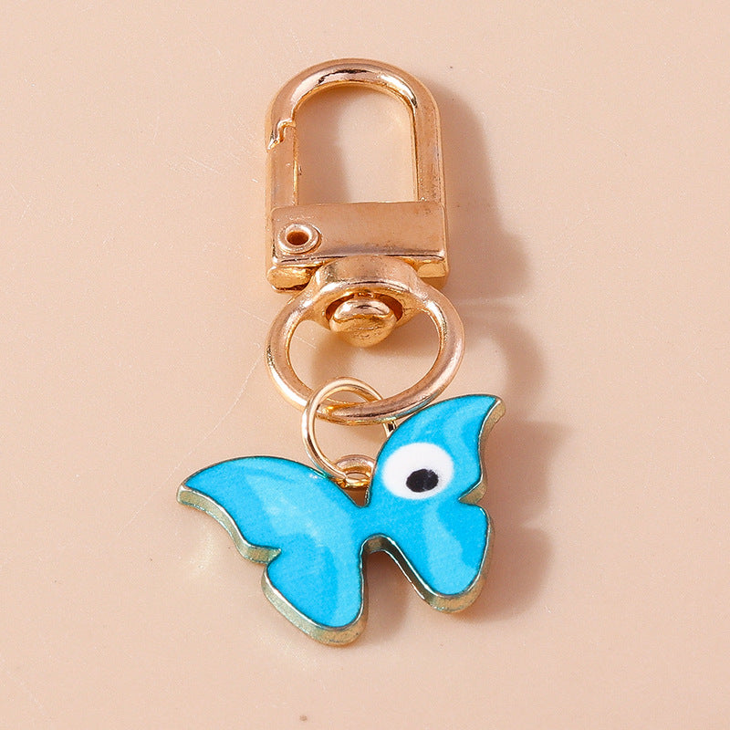 Wholesale Cartoon Butterfly Eyes Zinc Alloy Keychain