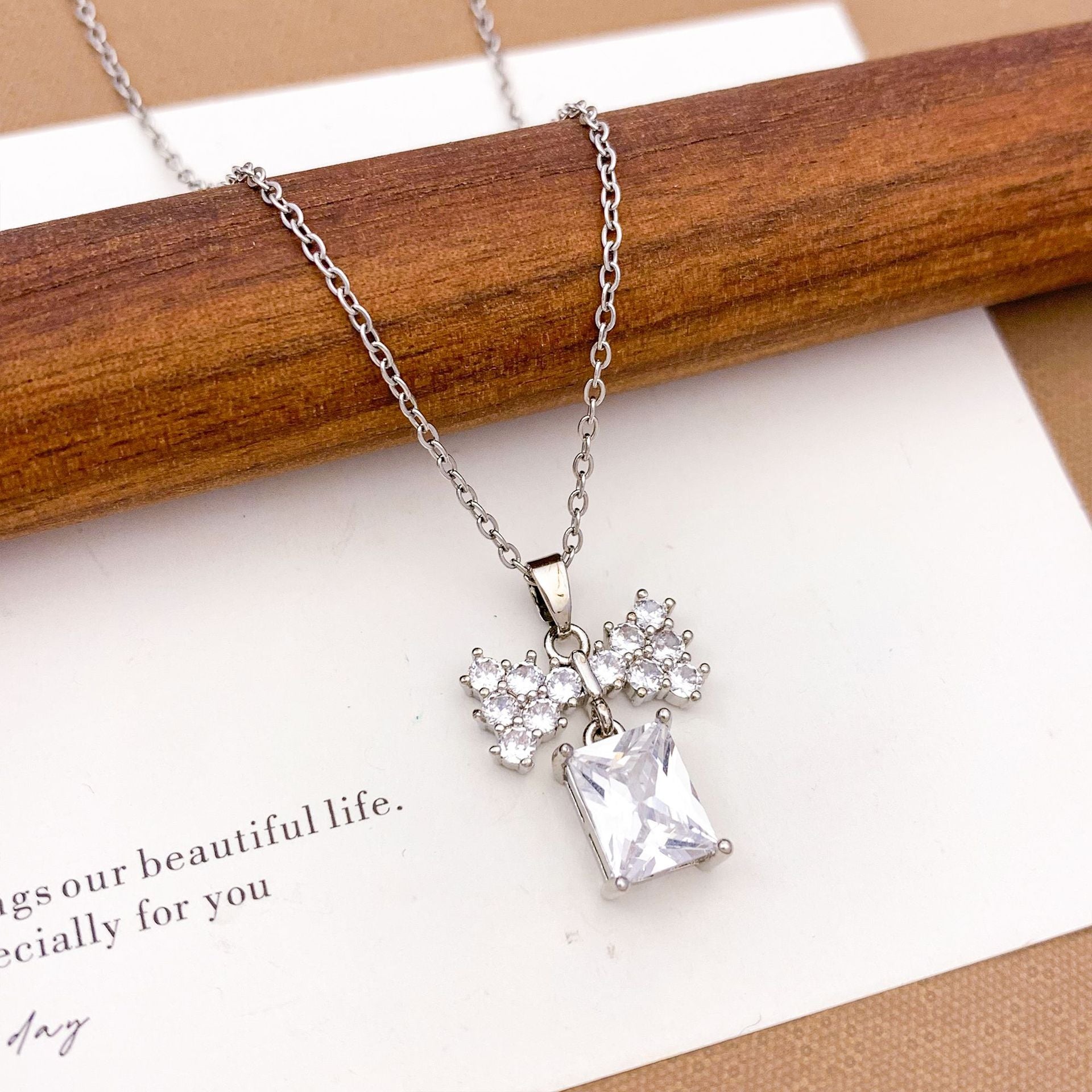 Wholesale Pink heart-shaped bow with diamond studded titanium steel necklace