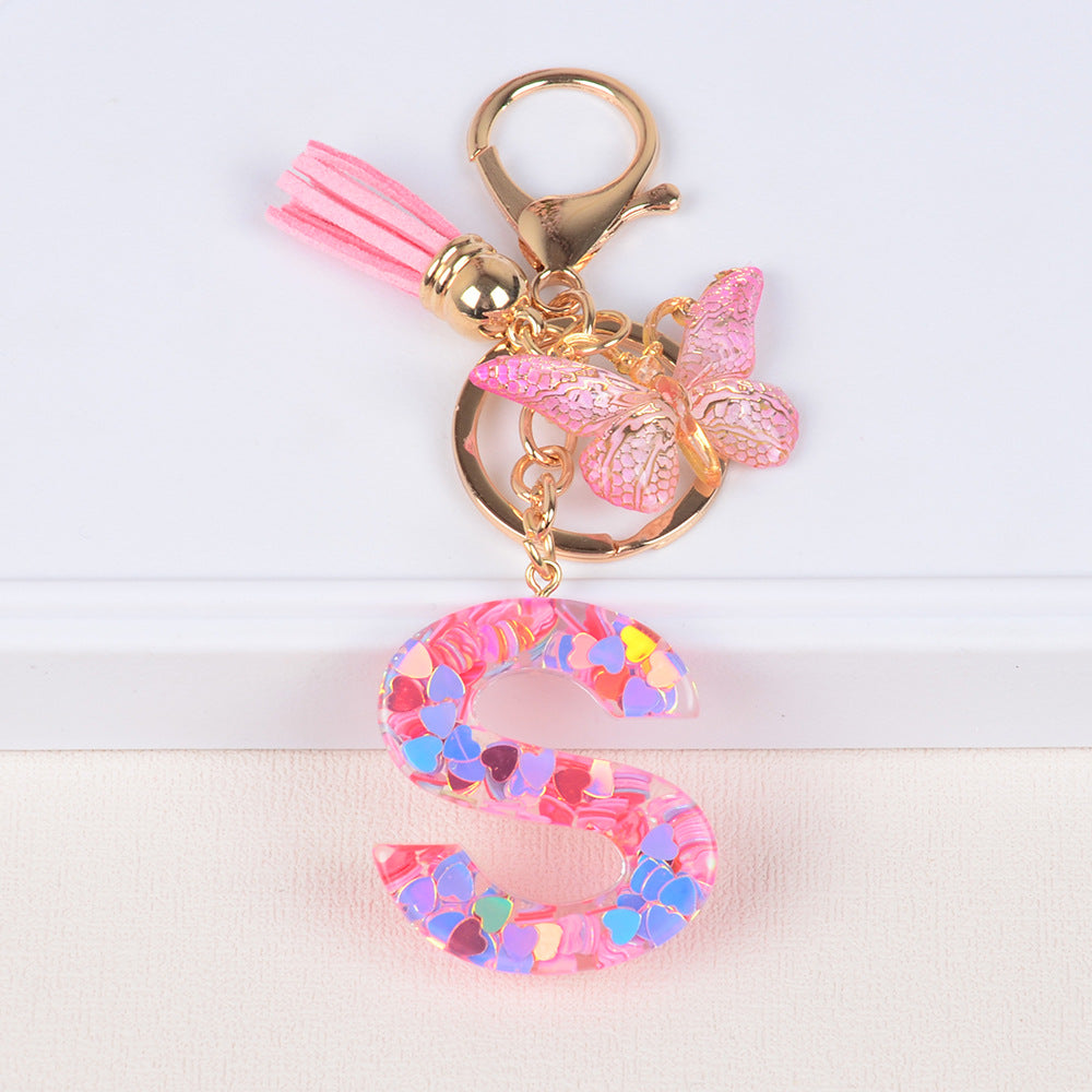 卸売ピンクタッセルバタフライグリッターレター樹脂キーホルダー