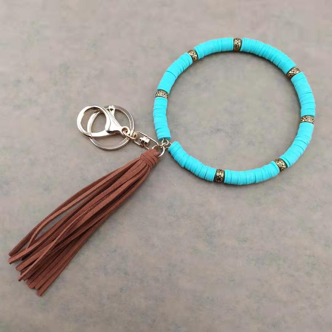 Llavero de muñeca de borla de arcilla colorida al por mayor