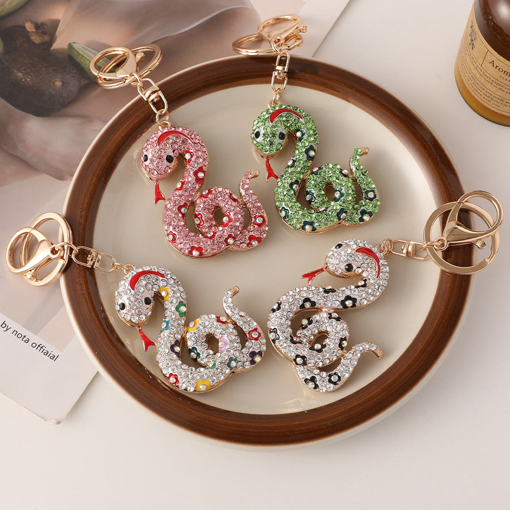 Wholesale Creative cartoon diamond twelve zodiac snake metal car keychain national tide this year pendant small gifts