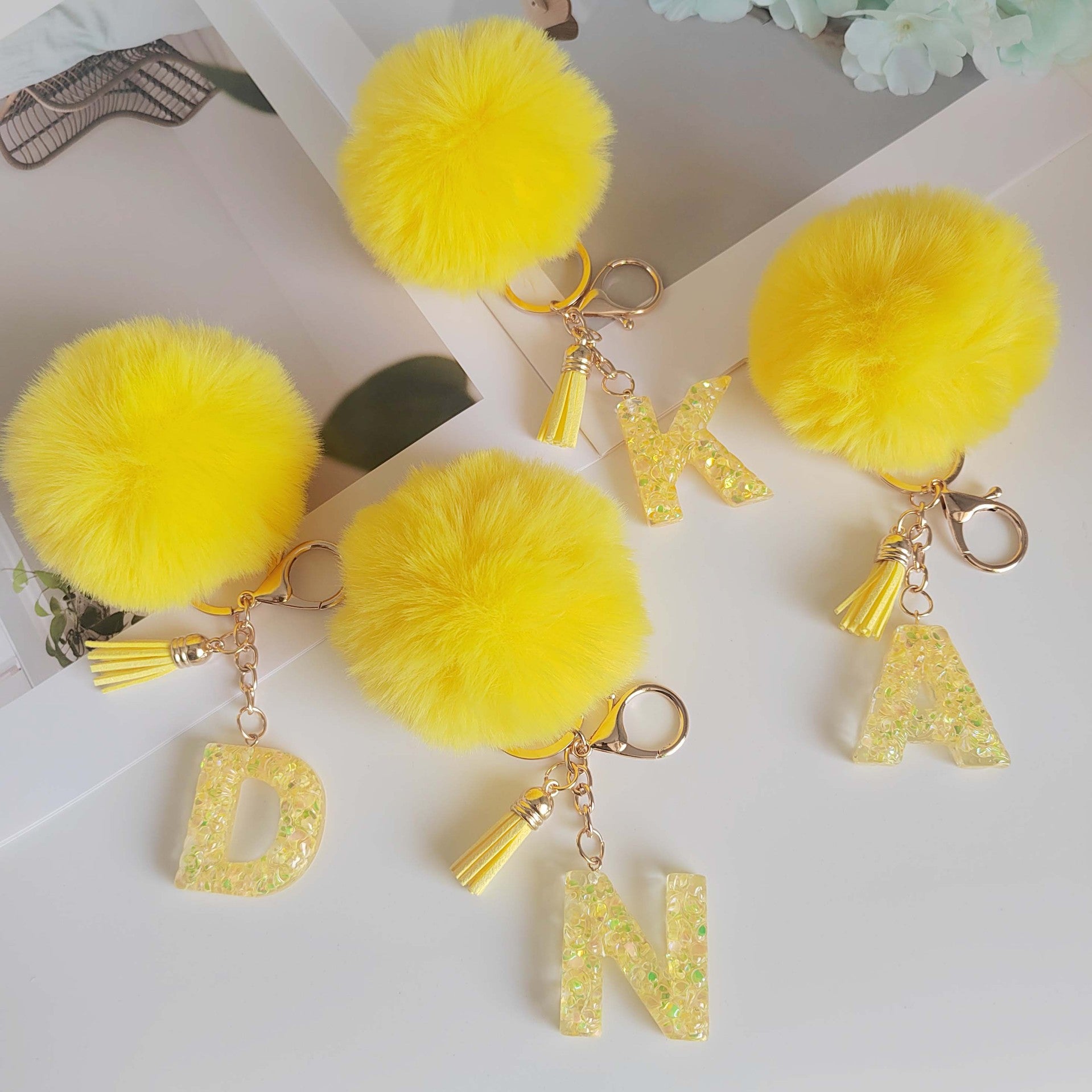 Wholesale Yellow letter ball pendant flower shaped letter keychain