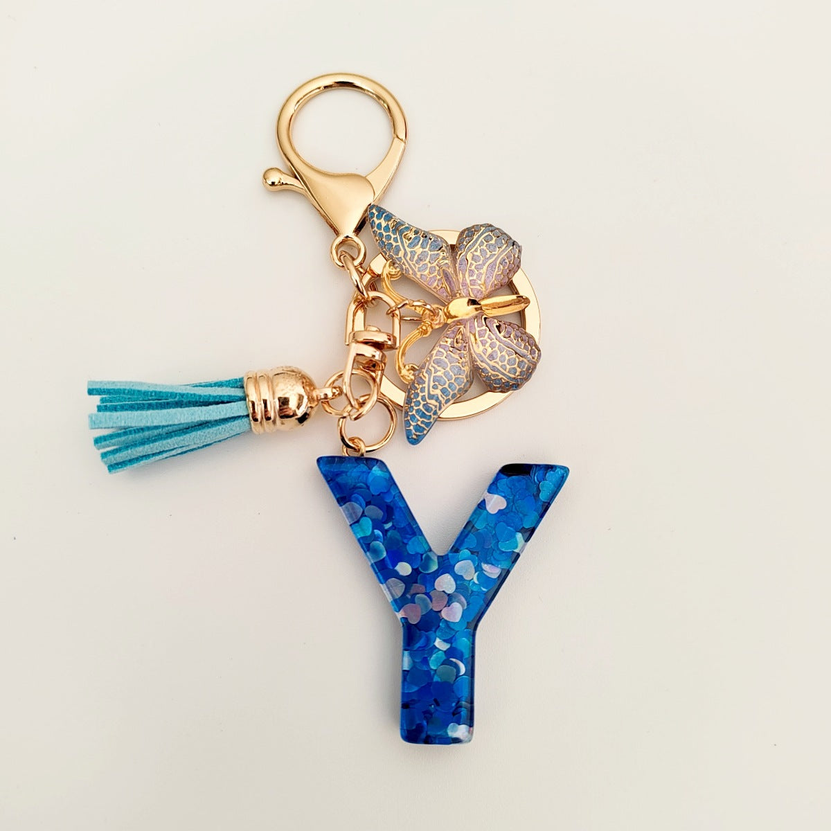 Wholesale blue crystal epoxy letter key chain pendant resin sequined butterfly key chain