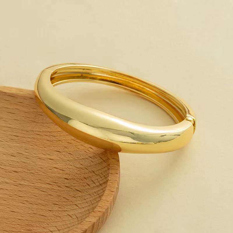 Wholesale Golden wide edged wave band exaggerated bracelet