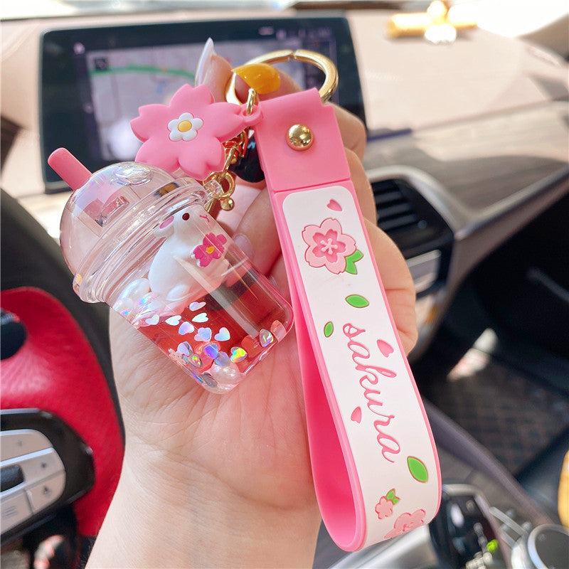 Wholesale Cherry Blossom Bunny Into Oil Milk Tea Cup Floating Bottle Acrylic Keychain