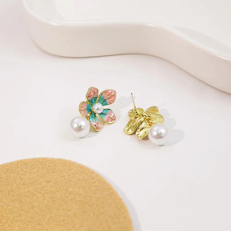 Wholesale Sweet oil-drop flower pearl earrings enamel powder blue petal earrings