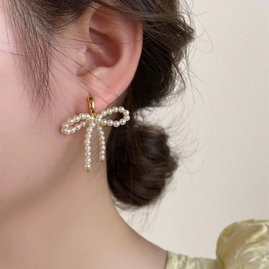 Wholesale Lady-style bow pearl earrings