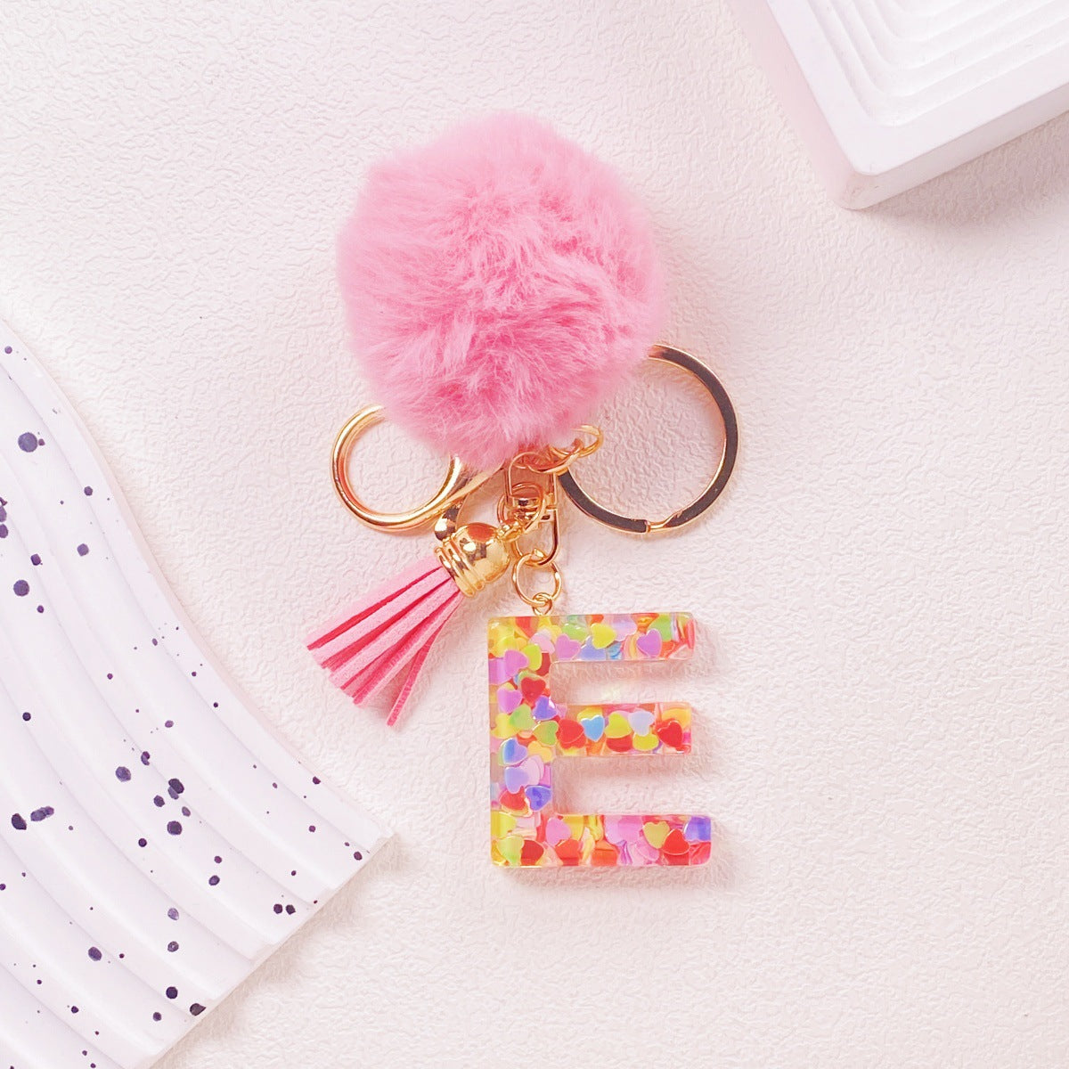 Wholesale Hairball English 26 letter pink Pom Pom keychain