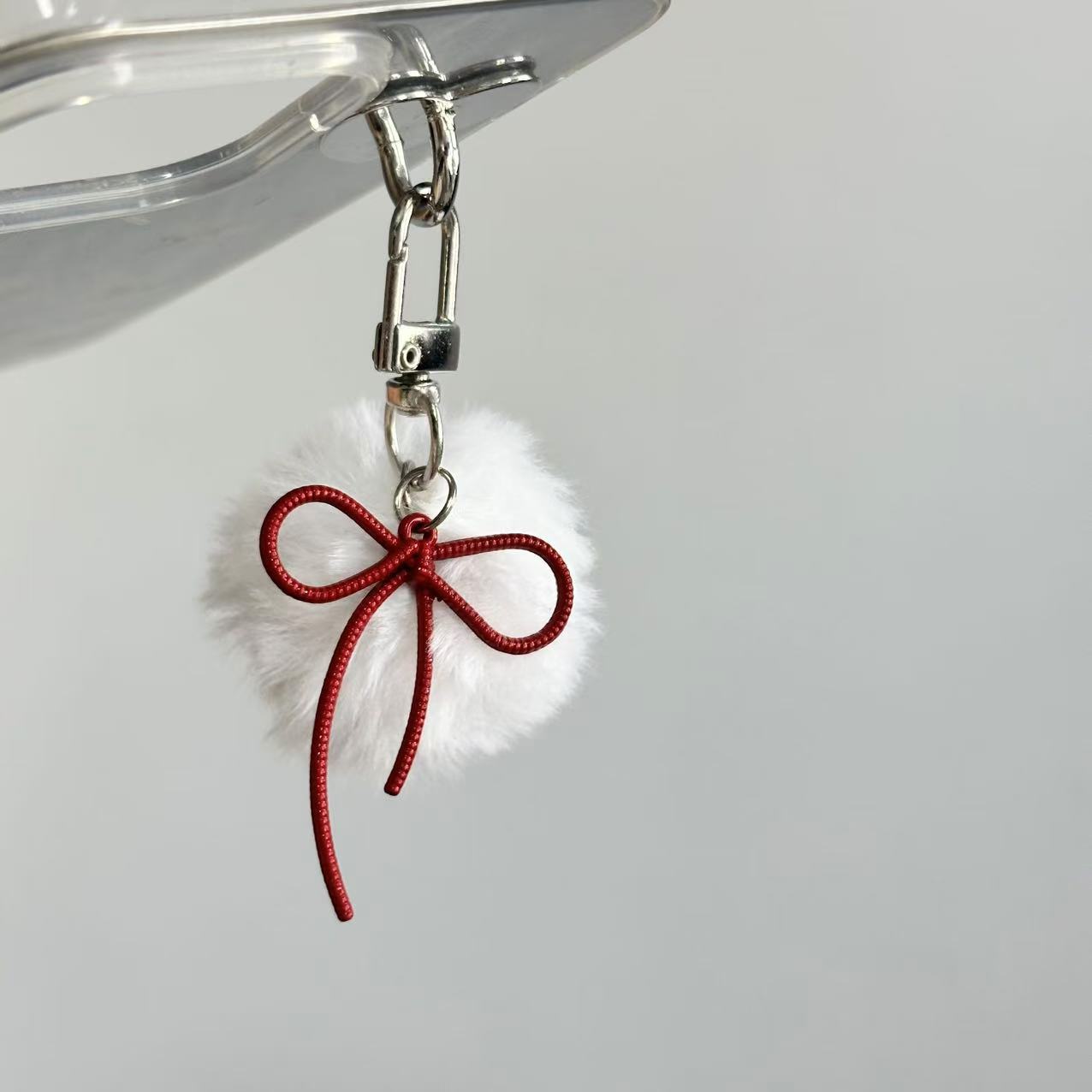 Wholesale Retro keychain with small fur ball and bow