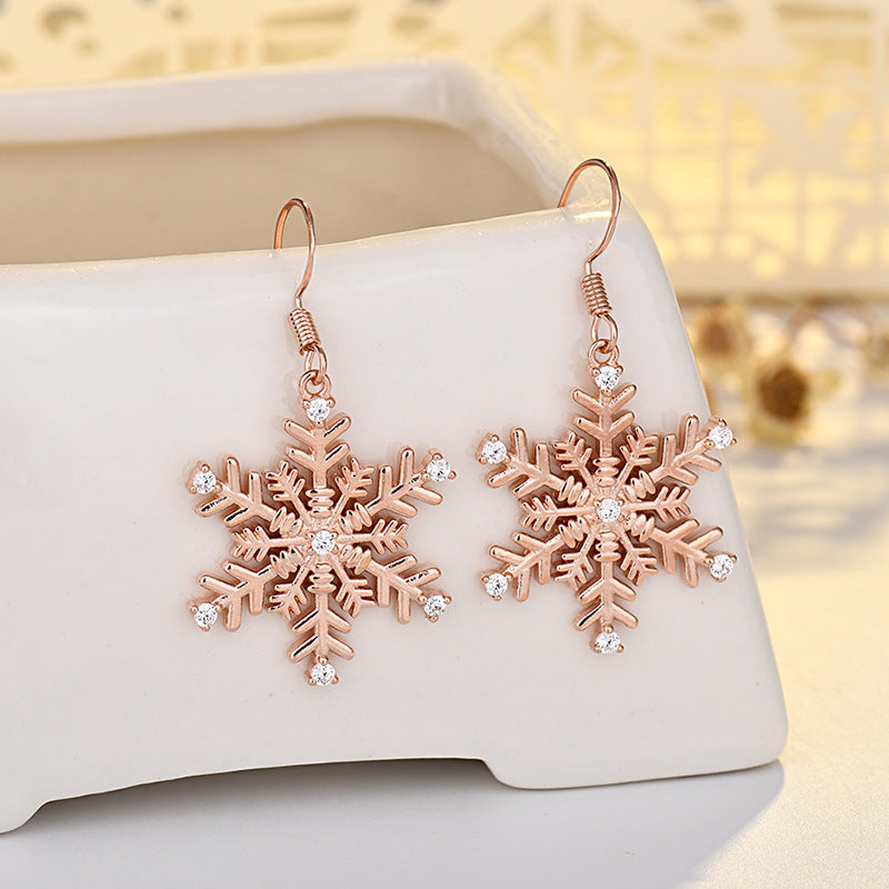 Wholesale Large gold-tone earrings with micro-embellished snowflakes