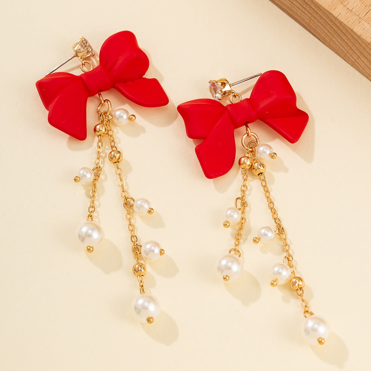 Wholesale red bow earrings imitate the pearl tassel earrings