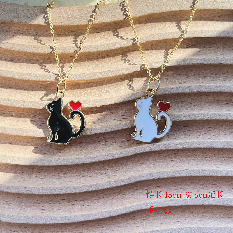 Wholesale Black and white cute heart-shaped cat earrings