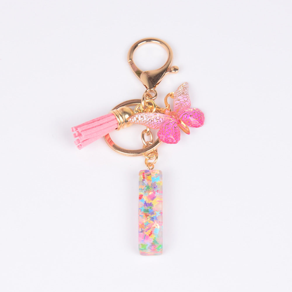 卸売スパンコール英語蝶タッセル文字樹脂キーホルダー